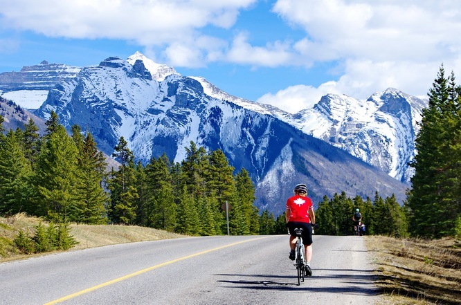 Cycling the road to Lake Minnewanka in Banff National Park, photo courtesy of HikeBikeTravel.com