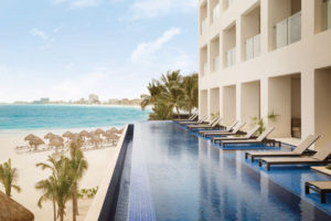 Swim-up balcony suite at Hyatt Ziva Cancun. Balcony pool overlooking beach below